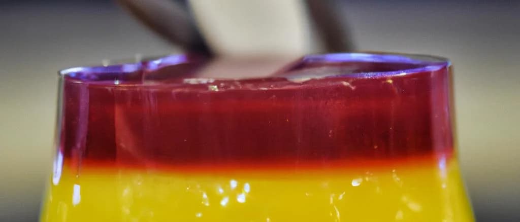 Assorted sweet mousses in elegant packaging on varied backgrounds