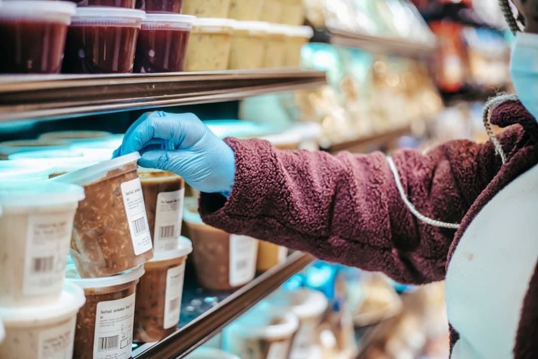 woman reading food label