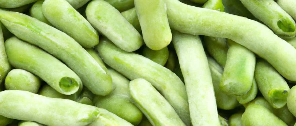 Various packages of frozen lima beans with green leaves on a white background