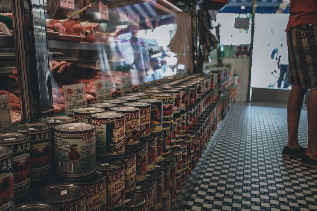 Canned tomatoes on a shelf