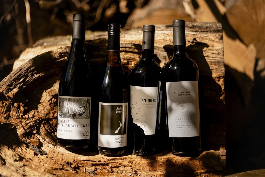four bottles of wine of different varieties and origins